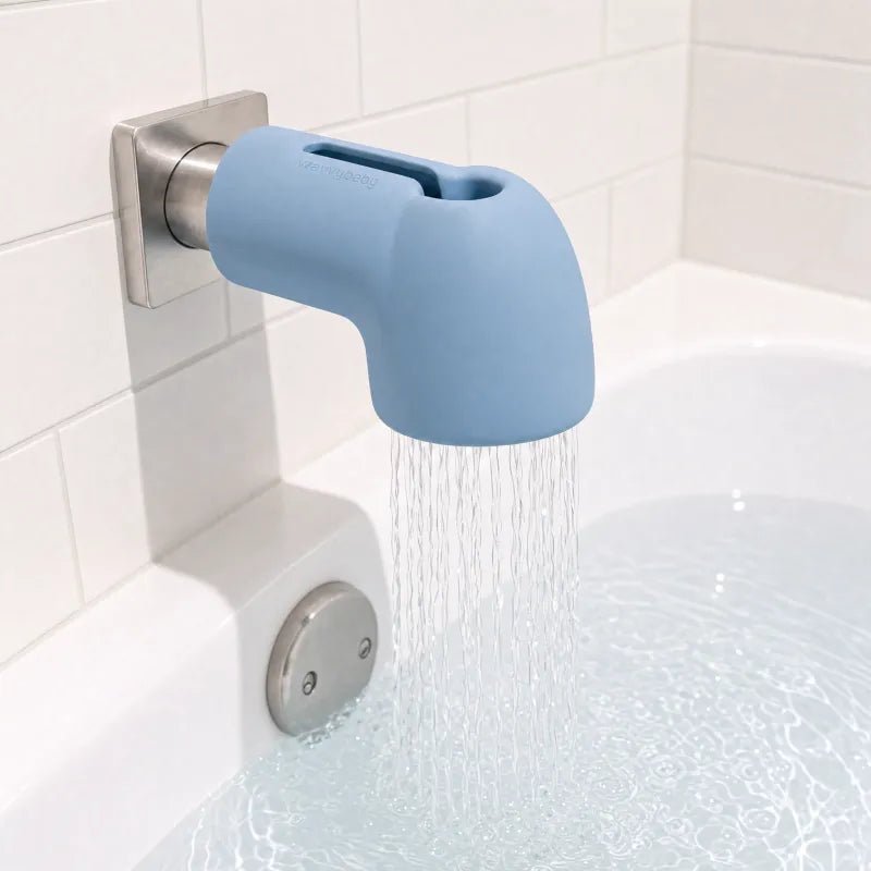 Water flowing through the installed WavvyBaby filter into the bathtub