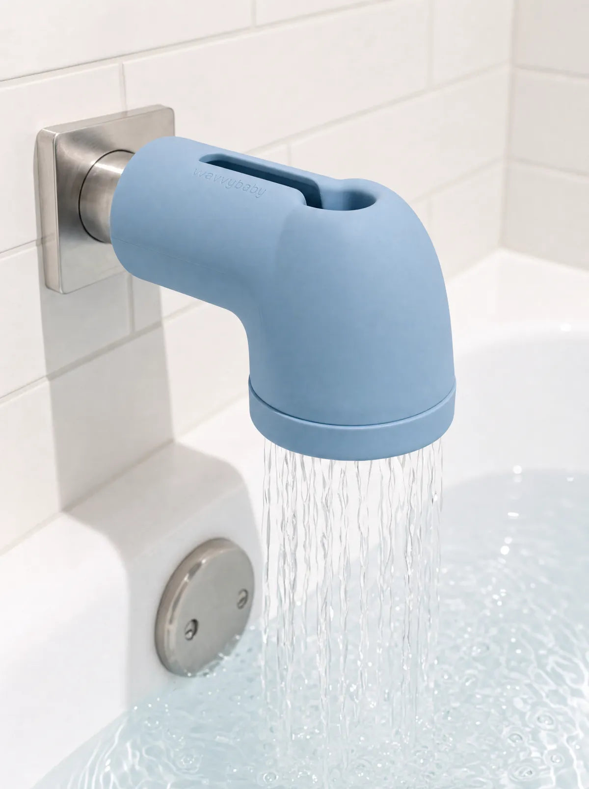 WavvyBaby bathtub filter on a tub spout, filtering bath water as the tub fills